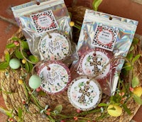 a basket of easter decorations with a cross on it